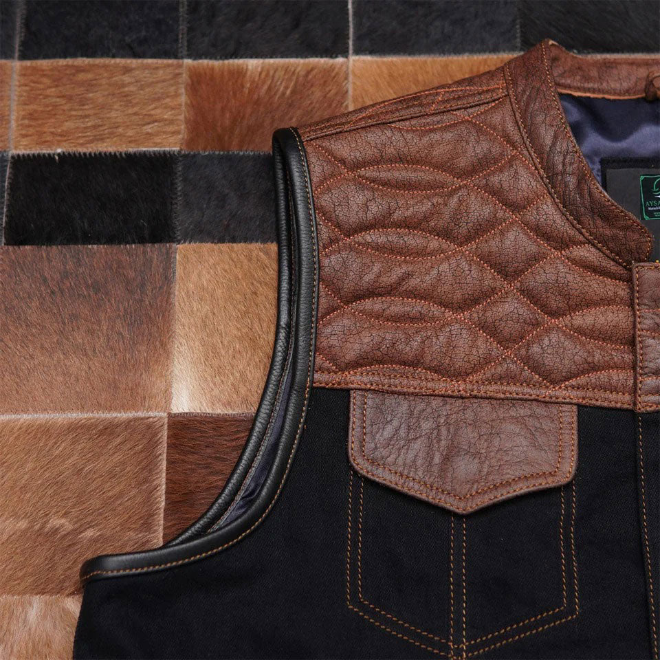 Close-up of a quilted leather vest with a plaid pattern