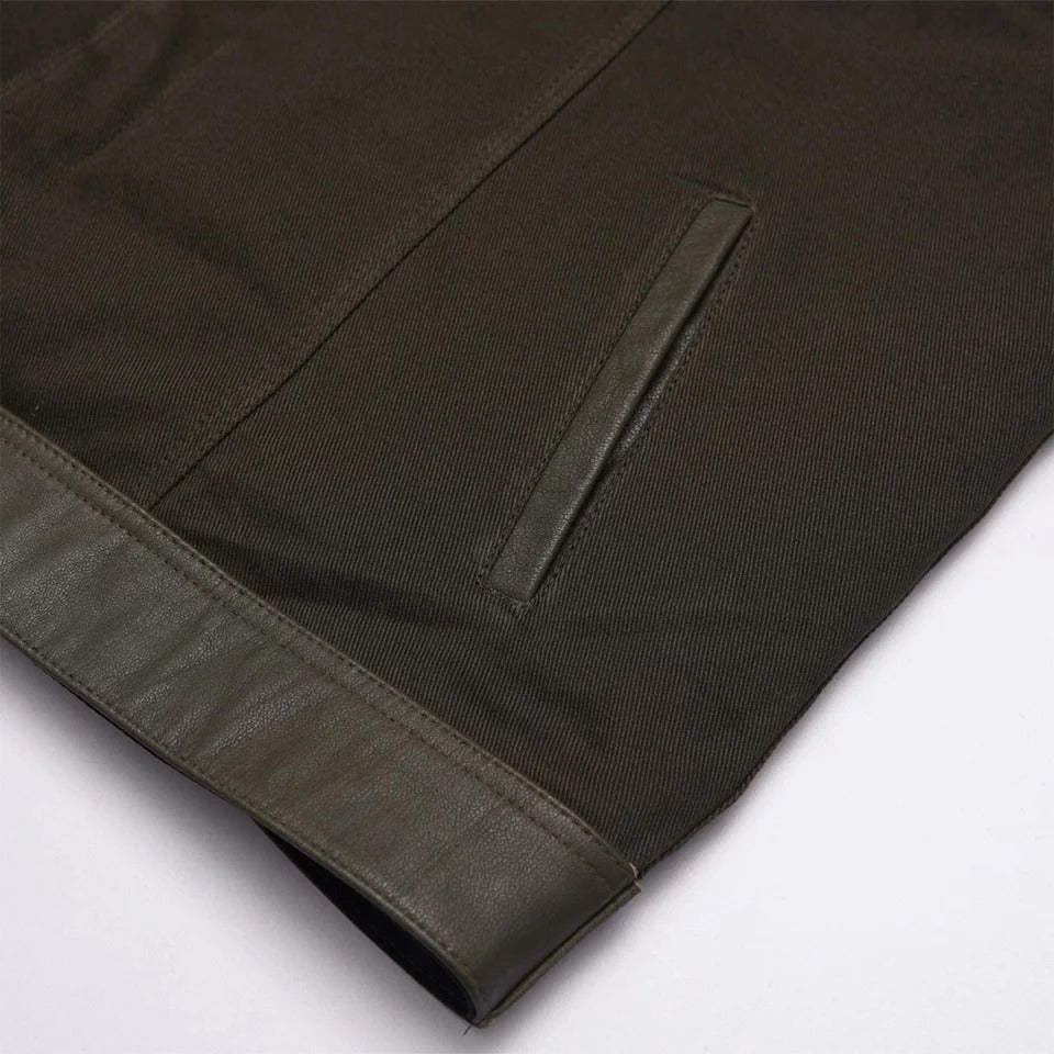 Close-up of a dark brown fabric with a seam
