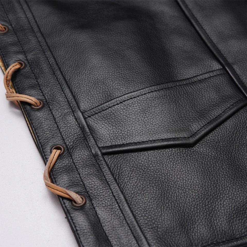 Close-up of a black leather vest with brown laces