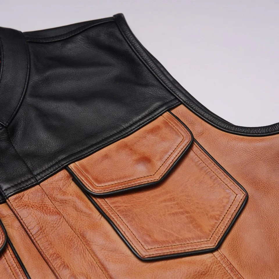 Close-up of a brown leather vest with a black collar