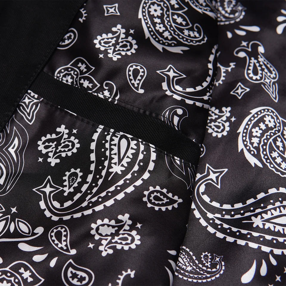 Close-up of black fabric with white paisley pattern