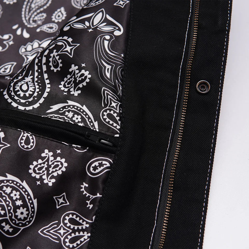 Close-up of a black jacket with white paisley pattern on the lining.