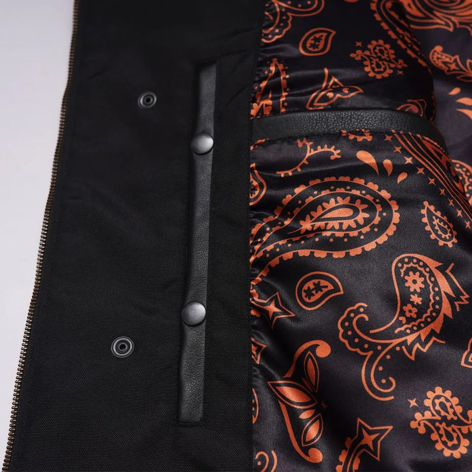 Black coat with orange paisley pattern 