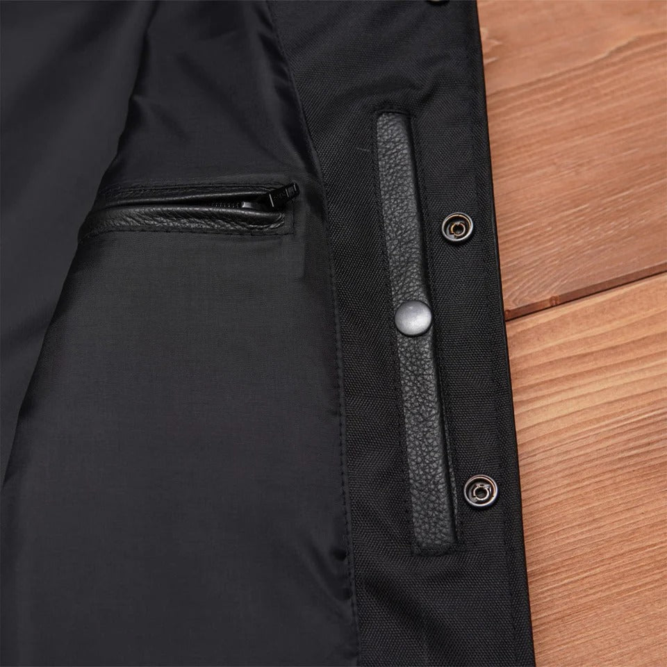 Close-up of a black jacket with leather trim