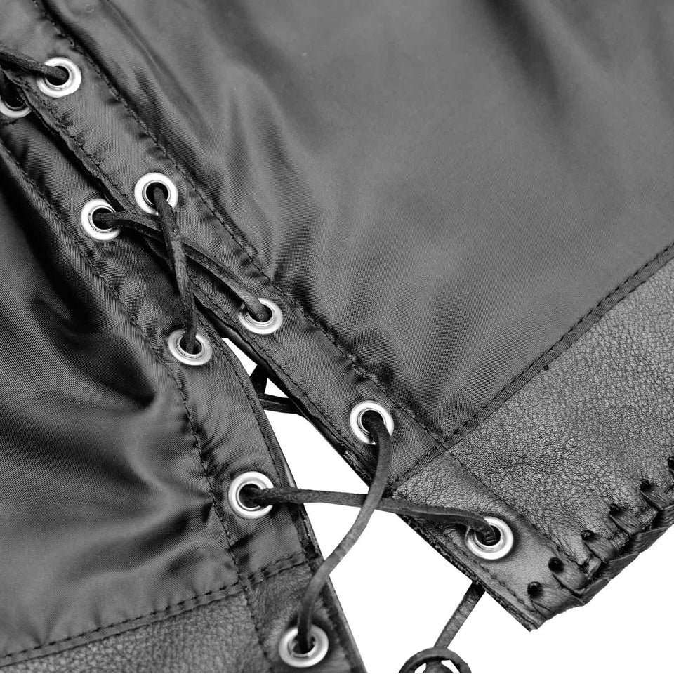 Close-up of a black lace-up garment with metal eyelets