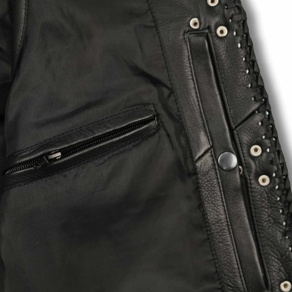 Close-up of a black leather jacket with studded details and zipper.