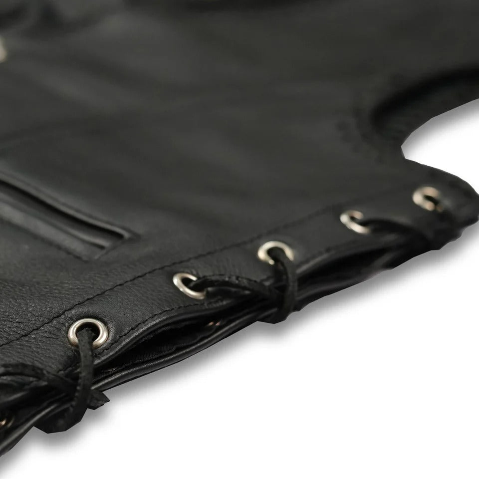 Close-up of a black leather bag with metal eyelets 